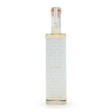 Tub Club Tobacco Vanilla white glass bubble soak lifestyle display for sophisticated bath fragrance experience.