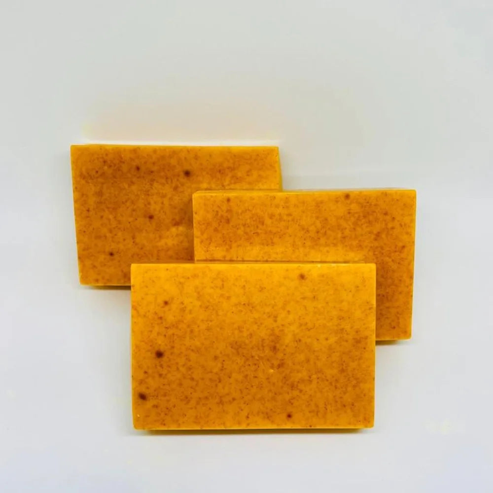 Three Turmeric Lemon Kojic Acid Handmade Soap bars on a clean white background.