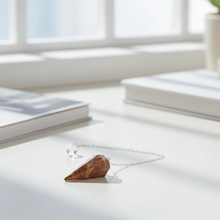 Unakite Jasper crystal pendulum for divination, energy work, and meditation practice.