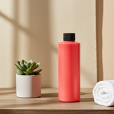 Vanilla Tobacco body oil bottle for softening skin, locking in moisture, and after-shower body care.