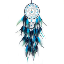 Vibrant feather dreamcatcher with crystal details for nursery wall decor, peaceful bedtime settings, and bohemian home accents.