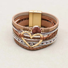 Vintage style metal heart leather bracelet for retro-inspired styling, casual wear, and everyday accessory use.