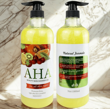 Two bottles of AHA beauty skin shower gel on a light background