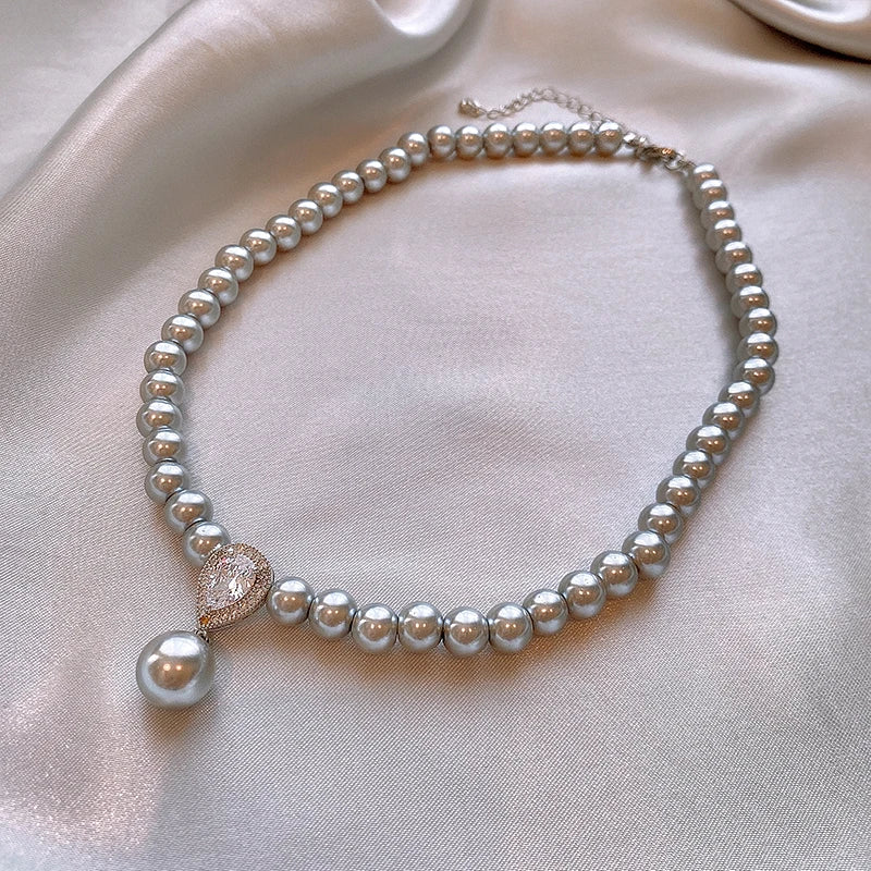 Pearl & Zircon water-drop pendant jewelry piece for bridal looks, evening wear, and refined fashion styling.