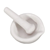 Mini Porcelain Mortar & Pestle Set white porcelain bowl and pestle for crushing tablets, herbs, and kitchen ingredients.
