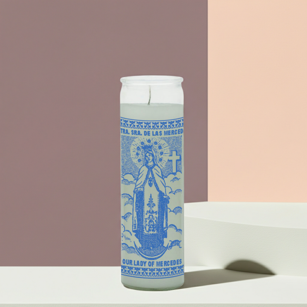 White Our Lady of Merced seven day prayer candle in tall glass jar for daily prayer, faith devotion, and home altar use.