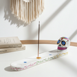 White Sugar Skull incense burner for holding incense sticks during meditation, relaxation, and home fragrance use.