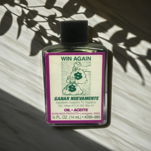 Win Again Wish Oil anointing oil bottle for luck, wish work, and spiritual practice.