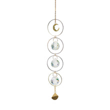Window hanging prism crystal ball ornament for catching sun rays and creating rainbow patterns in living spaces.