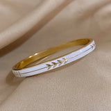 Women’s enamel leaf stainless steel bangle cuff for accessorizing workwear, casual looks, and special occasions.