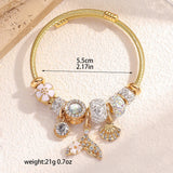 Women’s beaded gold mermaid cuff bangle for mermaid-themed fashion, resort wear, and accessorizing special occasion looks.