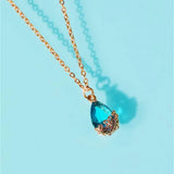 Women’s boho gold crystal drop pendant necklace for fashion accessorizing, weekend outfits, and gift giving.