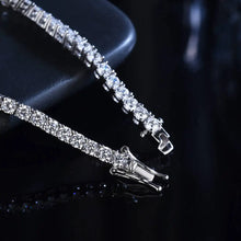 Women’s moissanite tennis bracelet in sterling silver for weddings, parties, and refined daily fashion.