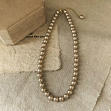 Pearl & Zircon teardrop pendant for women’s occasion wear, dinner outfits, and elegant jewelry styling.