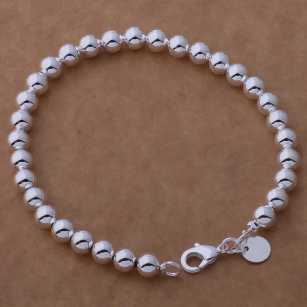 Women’s Polished 925 Sterling Silver Heart Chain Bracelet silver bracelet for polished daily looks, gifting, and special occasions.