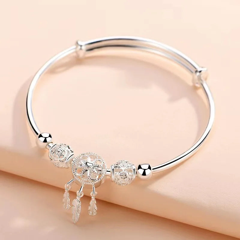 Silver Dreamcatcher Charm women’s adjustable bangle bracelet for daily wear, outfit coordination, and stylish accessorizing.