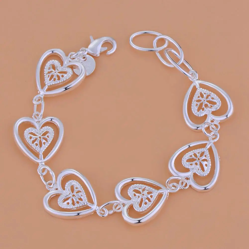 Women’s Sterling Silver Heart Chain Bracelet jewelry bracelet for casual outfits, layering with necklaces, and gift occasions.