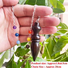 Wooden Karnak Pendulum for dowsing, divination, and energy work.