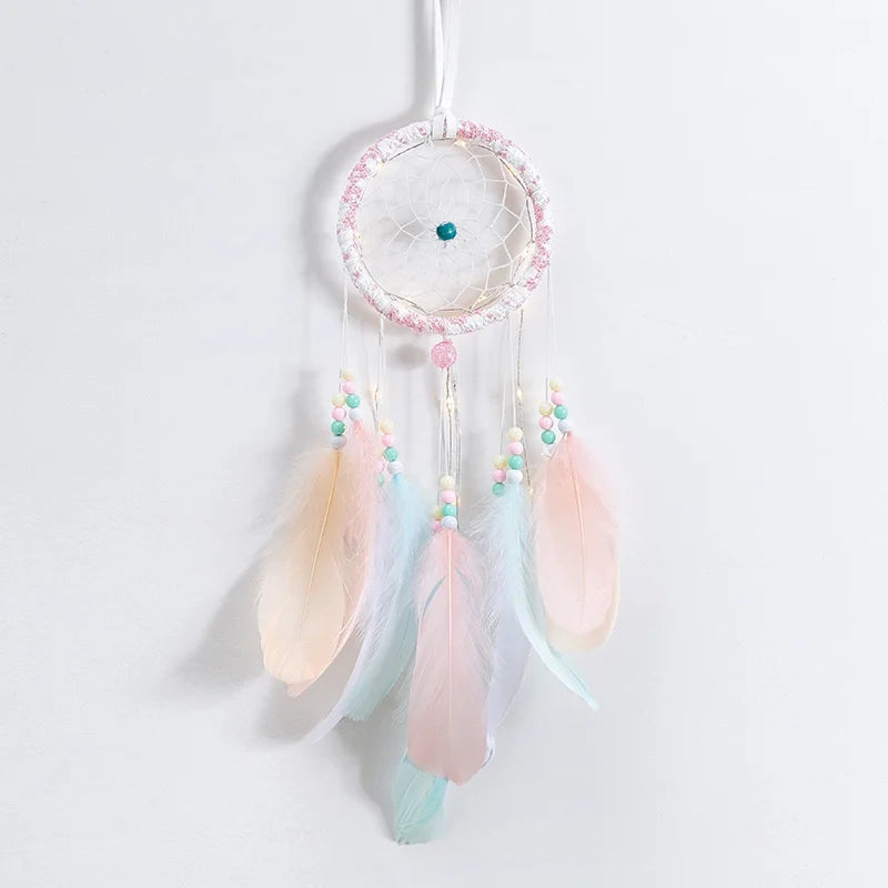 Woven dream catcher with LED lights and feathers for wall decoration, sleep space styling, and cozy home ambiance.