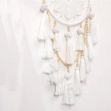 Woven dreamcatcher wind chime with Nordic tassels for nursery decor, window hanging, and bohemian room accent use.
