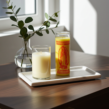 Yellow Our Lady of Guadalupe 7 day prayer candle in glass container for novena prayer, blessing, and devotional practice.