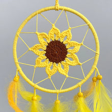 Yellow sunflower dream catcher with feathers for nursery decor, peaceful sleep spaces, and decorative wall hanging use.