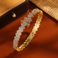 ZAKOL iced-out CZ heart charm bracelet for fashion styling, party wear, and everyday jewelry use.
