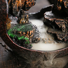 Zen Buddha Waterfall Backflow Incense Burner in use with incense smoke for a calming meditation atmosphere.
