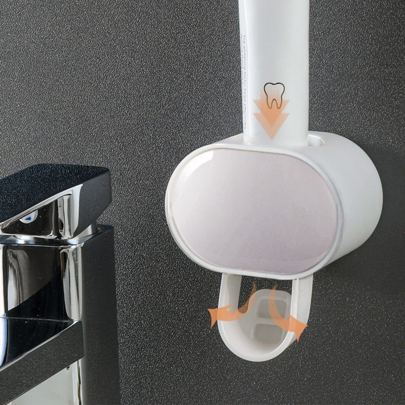 Automatic Toothpaste Dispenser in family bathroom mounted at convenient height for adults and children.
