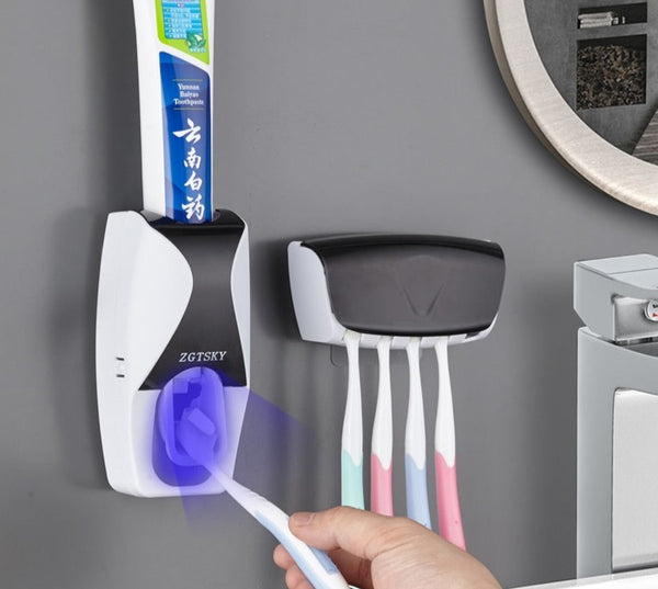 Automatic Toothpaste Dispenser Set full product display showing dispenser and toothbrush holder.