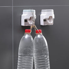 Wall Mount Automatic Toothpaste Dispenser tool-free adhesive strip installation on smooth bathroom surface.