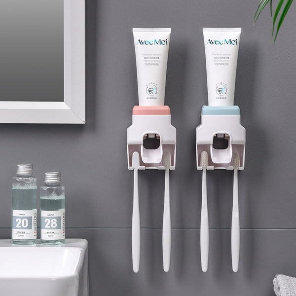 Wall Mount Automatic Toothpaste Dispenser installed on bathroom wall with integrated toothbrush holder.