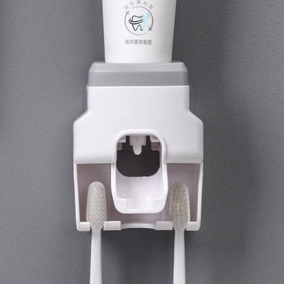 Wall Mount Automatic Toothpaste Dispenser with three toothbrush slots and anti-drip dispenser mechanism.